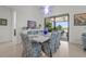 Dining area with table and chairs and access to the lanai, perfect for entertaining at 14480 Eagle Branch Dr, Nokomis, FL 34275
