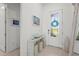 Inviting foyer with decorative front door, stylish console table, and modern decor, creating a welcoming entrance at 14480 Eagle Branch Dr, Nokomis, FL 34275