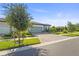 Beautiful home with a two-car garage, paver driveway, and lovely landscaping in a quiet neighborhood at 14480 Eagle Branch Dr, Nokomis, FL 34275