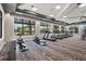 Bright gym with various machines, complemented by scenic outdoor views through large windows at 14480 Eagle Branch Dr, Nokomis, FL 34275