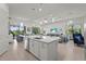 Gourmet kitchen with island, perfect for entertaining, flows into dining and living areas at 14480 Eagle Branch Dr, Nokomis, FL 34275