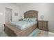Main bedroom with light wood furnishings, a large window, and calm color palette at 14480 Eagle Branch Dr, Nokomis, FL 34275