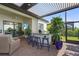 Entertainer's patio featuring an outdoor bar with seating, built-in grill, and outdoor television, great for social gatherings at 14480 Eagle Branch Dr, Nokomis, FL 34275
