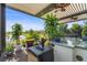 Outdoor bar area with beer dispenser, grill, and lake view, great for entertaining guests in a relaxed setting at 14480 Eagle Branch Dr, Nokomis, FL 34275