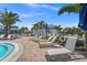 Relaxing pool area with lounge chairs and umbrellas for enjoying the Florida sunshine at 14480 Eagle Branch Dr, Nokomis, FL 34275