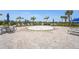 Interactive splash pad for Gathering fun surrounded by seating areas and shaded spots at 14480 Eagle Branch Dr, Nokomis, FL 34275