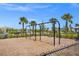 Swings surrounded by wood chips and greenery at the community playground at Talon Preserve on Palmer Ranch at 14480 Eagle Branch Dr, Nokomis, FL 34275