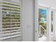 View of the beach from the bedroom balcony with shuttered window at 3007 Avenue F # 1, Holmes Beach, FL 34217