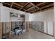 Basement featuring clean tile floors, exposed rafters, open stud walls, and storage at 3007 Avenue F # 1, Holmes Beach, FL 34217