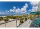 Stunning beachfront deck with comfortable seating overlooking the Gulf, perfect for enjoying sunsets and outdoor relaxation at 3007 Avenue F # 1, Holmes Beach, FL 34217