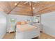 Cozy bedroom with white furnishings and a view of the ocean at 3007 Avenue F # 1, Bradenton Beach, FL 34217