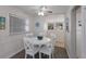 Bright dining area with a round table and seating for four, perfect for casual meals at 3007 Avenue F # 1, Holmes Beach, FL 34217