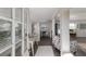 Bright entryway featuring a glass-topped table and a view into the living area with coastal-themed decor at 3007 Avenue F # 1, Bradenton Beach, FL 34217