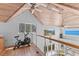 Bright upstairs area with wood ceiling, an exercise bike, and views of ocean at 3007 Avenue F # 1, Holmes Beach, FL 34217