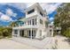 Charming multi-level home with a beachfront deck and inviting outdoor spaces, perfect for coastal living at 3007 Avenue F # 1, Holmes Beach, FL 34217