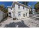Charming two-story home with a light exterior, access stairs, and a beach view at 3007 Avenue F # 1, Holmes Beach, FL 34217