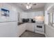 Functional kitchen with white appliances and ample counter space, ideal for preparing meals at 3007 Avenue F # 1, Bradenton Beach, FL 34217