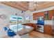 Open kitchen featuring granite counters and beach view at 3007 Avenue F # 1, Holmes Beach, FL 34217