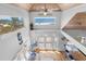 Bright open-plan living space with coastal decor and ocean views at 3007 Avenue F # 1, Holmes Beach, FL 34217