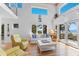 Bright living room features beach view, wood floors, and modern decor at 3007 Avenue F # 1, Holmes Beach, FL 34217