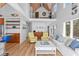 Bright, open living room with high ceilings, wooden floors, and comfortable seating at 3007 Avenue F # 1, Holmes Beach, FL 34217