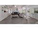 Open-concept living area with comfortable seating and abundant natural light from multiple windows at 3007 Avenue F # 1, Holmes Beach, FL 34217
