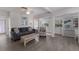 Bright living area with comfortable seating, wood-look floors, and a seamless flow to other rooms at 3007 Avenue F # 1, Holmes Beach, FL 34217