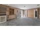 Room under construction showing potential for renovations with large window, door, and concrete flooring at 3007 Avenue F # 1, Holmes Beach, FL 34217