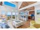 Bright living room with a vaulted ceiling, a view of the ocean, an island and hardwood floors at 3007 Avenue F # 1, Holmes Beach, FL 34217