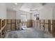 Empty room in the middle of remodeling with two large windows and a modern fan at 3007 Avenue F # 1, Holmes Beach, FL 34217