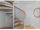 Unique spiral staircase with metal frame and wooden steps at 3007 Avenue F # 1, Bradenton Beach, FL 34217
