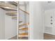 Unique spiral staircase with metal frame and wooden steps at 3007 Avenue F # 1, Holmes Beach, FL 34217