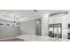 Bright kitchen with white cabinets, a countertop island, stainless steel appliances, and modern lighting at 3118 Tramonto Ct, Bradenton, FL 34211