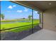 Relaxing screened-in porch overlooking a beautiful pond and lush green backyard at 3118 Tramonto Ct, Bradenton, FL 34211