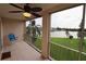 Relaxing screened balcony with a ceiling fan and a lovely lake view at 3807 Lake Bayshore Dr # H-416, Bradenton, FL 34205