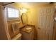 Cozy bathroom featuring granite countertop vanity, decorative mirror, and shower with curtain at 3807 Lake Bayshore Dr # H-416, Bradenton, FL 34205