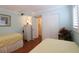 Inviting bedroom with two twin beds, closet, and decoratively painted nightstand at 3807 Lake Bayshore Dr # H-416, Bradenton, FL 34205