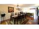 View of the dining room with seating for eight and hardwood floors at 3807 Lake Bayshore Dr # H-416, Bradenton, FL 34205