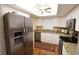 Updated kitchen featuring stainless steel appliances and granite countertops at 3807 Lake Bayshore Dr # H-416, Bradenton, FL 34205
