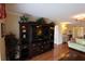 Living room with built-in entertainment center and views to hall and other rooms at 3807 Lake Bayshore Dr # H-416, Bradenton, FL 34205