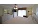 Main bedroom with full dressers, TV and window with blinds at 3807 Lake Bayshore Dr # H-416, Bradenton, FL 34205