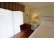Main bedroom showing window with blinds and easy chair at 3807 Lake Bayshore Dr # H-416, Bradenton, FL 34205