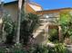 Tan condo building with tropical landscaping and private entrance, numbered 114 and 117 at 3810 75Th W St # 116, Bradenton, FL 34209