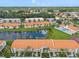 Beautiful aerial view of the community featuring a pool, pond, and lush landscaping, perfect for serene living at 4224 Madeira Ct # 3309, Sarasota, FL 34233
