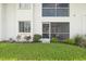 Well-maintained condo building with screened lanai, lush lawn, and lovely landscaping at 4224 Madeira Ct # 3309, Sarasota, FL 34233