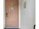 Front door view featuring a unique design, new hardware, and charming artistic wall decor at 4224 Madeira Ct # 3309, Sarasota, FL 34233