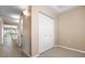 Bright bedroom featuring light-colored walls and wood flooring, with a closet and neutral decor at 5117 Melbourne St # B201, Punta Gorda, FL 33980