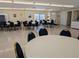 Large community room with tables and chairs, perfect for gatherings and activities at 5925 Todd St # D-21, Bradenton, FL 34207