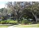 Lush landscaping with mature trees and well-maintained grounds at 2340 Canal Dr # G35, Bradenton, FL 34207