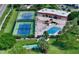 Aerial view of community with pool, tennis courts, and shuffleboard at 4600 Gulf Of Mexico Dr # 203, Longboat Key, FL 34228